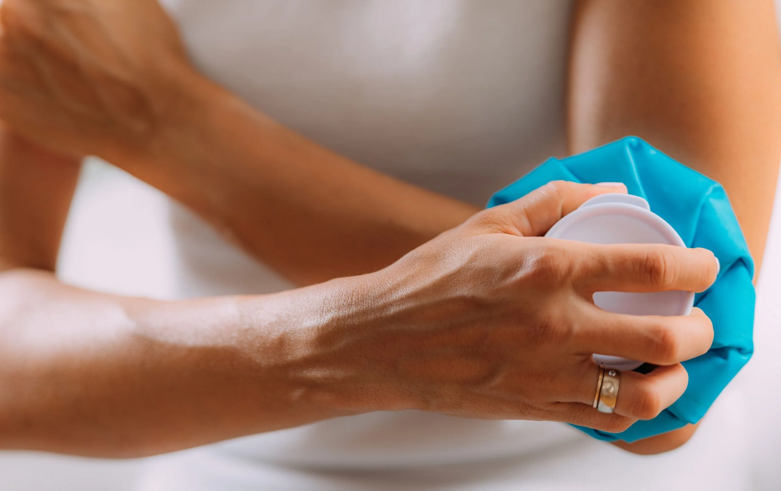 Ice pack on elbow for pain relief and treatment of elbow pain.