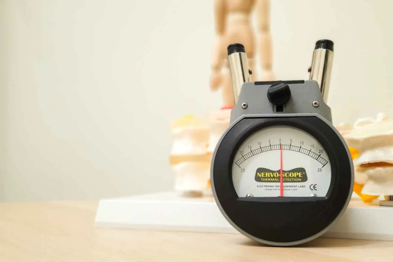 Nervo-Scope thermal detection device analyzing spine on anatomical model, Modern Movement Medicine.