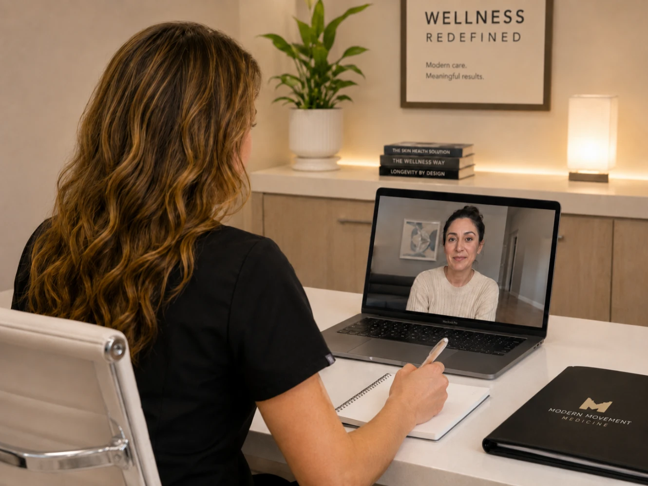 A healthcare provider participating in a virtual consultation with a patient on a laptop, emphasizing